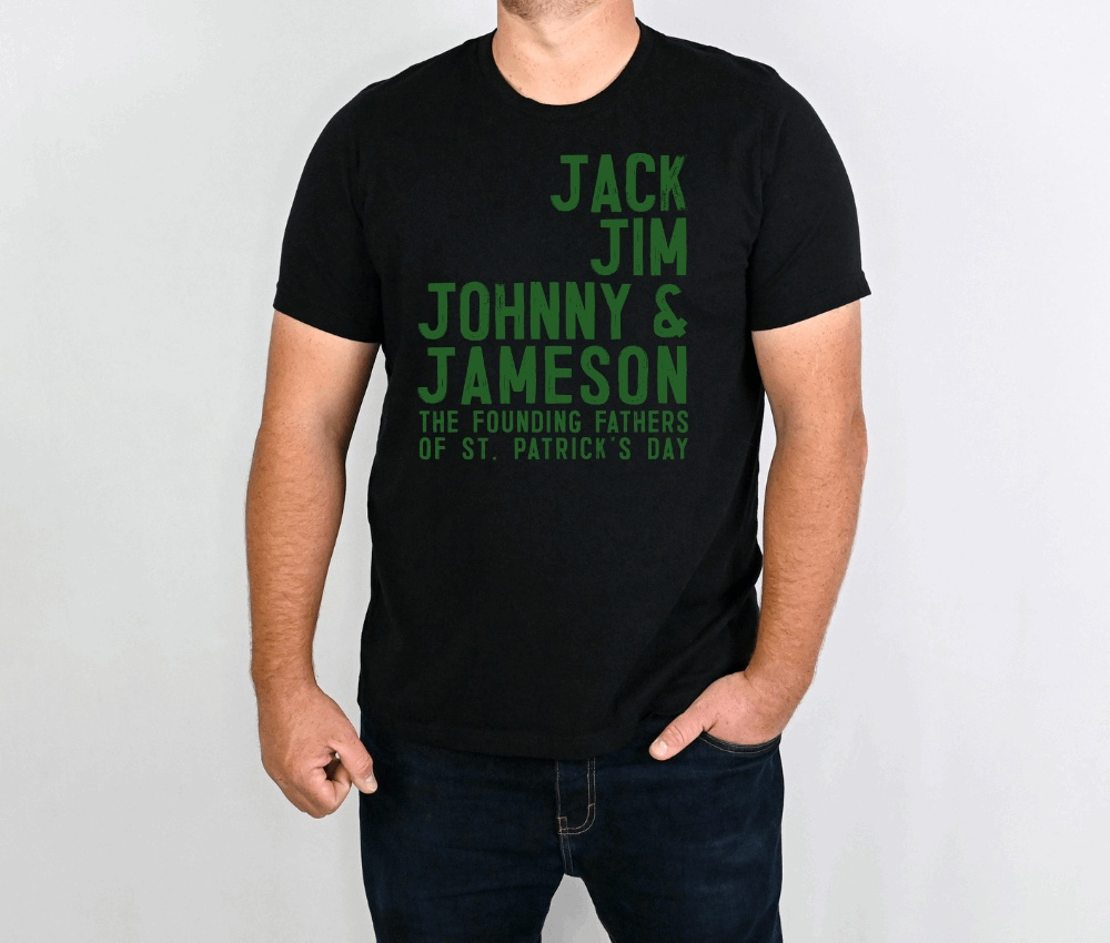 Black whiskey founding fathers t-shirt with green text listing Jack, Jim, Johnny & Jameson as the Founding Fathers of St. Patrick's Day worn by a male model
