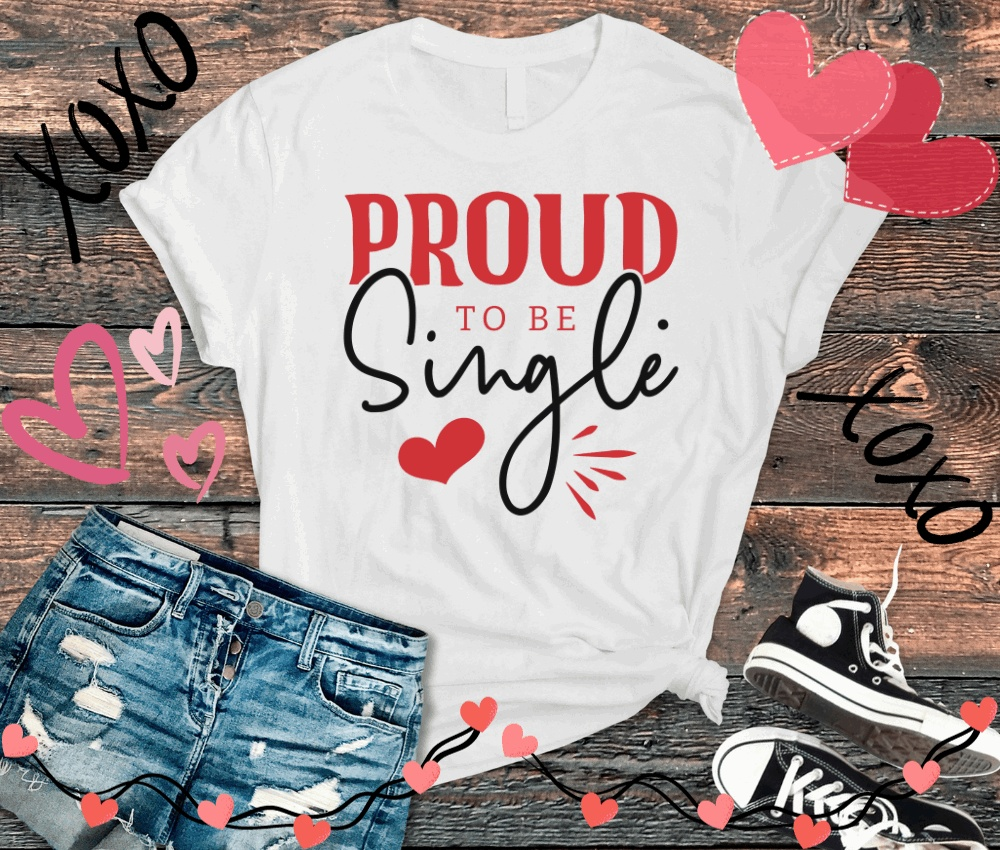 Proud To Be Single T-shirt for women, featuring bold red and black text with heart graphics, paired with distressed jeans and sneakers.