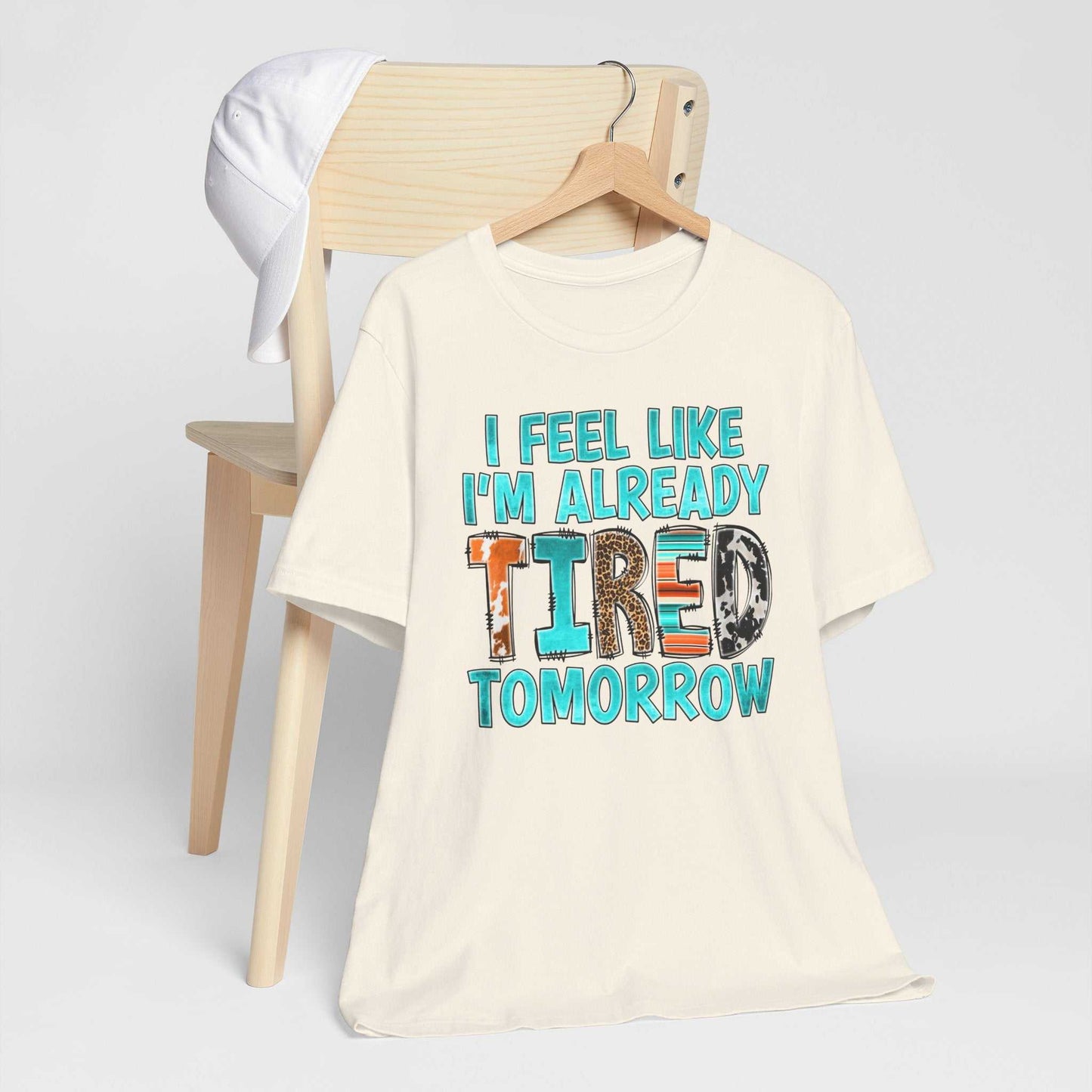 Tired Tomorrow Mental Health Matters T-shirt on chair, bold text design.