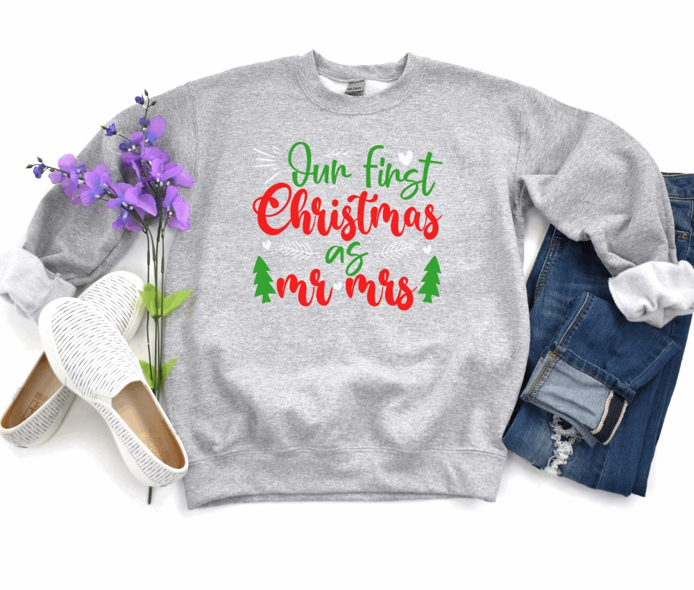 Unisex heavy blend crewneck sweatshirt with "Our First Christmas as Mr & Mrs" design, ideal for newlyweds.
