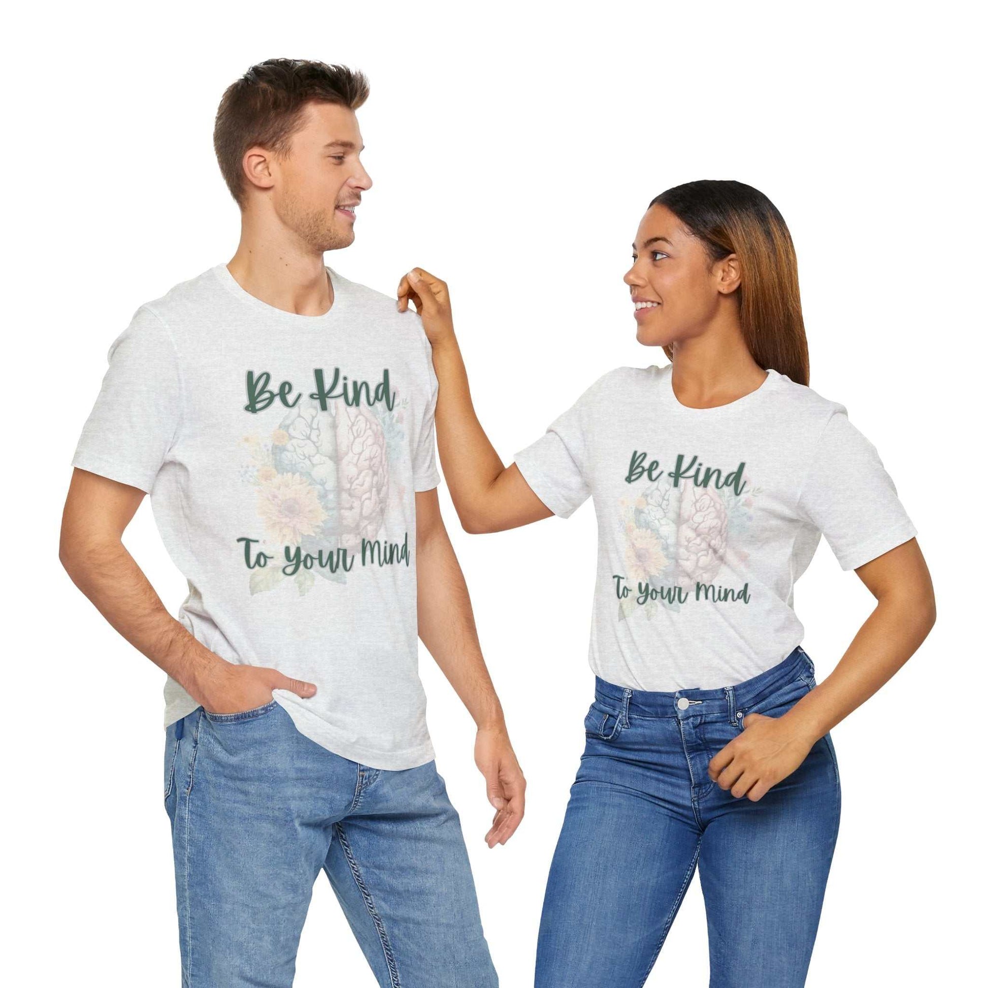 Unisex "Be Kind To Your Mind" t-shirt promoting mental health awareness, worn by two people.