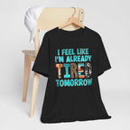 Black t-shirt with "I Feel Like I'm Already Tired Tomorrow" text, promoting mental health awareness.