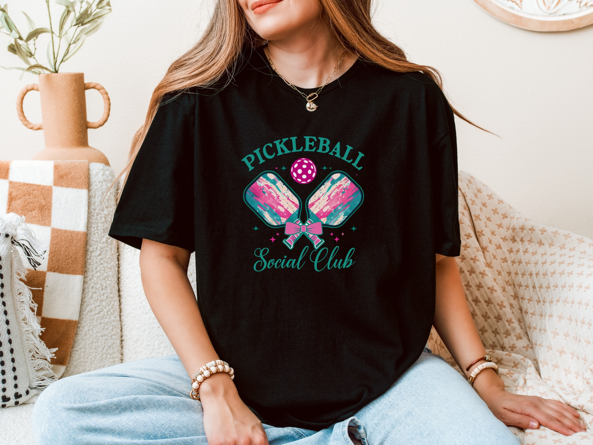 Unisex Pickleball Social Club softstyle shirt for women, featuring playful design on a black tee.