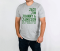Gray whiskey founding fathers unisex t-shirt with green text listing "Jack, Jim, Johnny & Jameson, The Founding Fathers of St. Patrick's Day" worn by male model