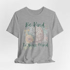 Be Kind To Your Mind T-Shirt featuring brain illustration and floral design promoting mental health awareness.