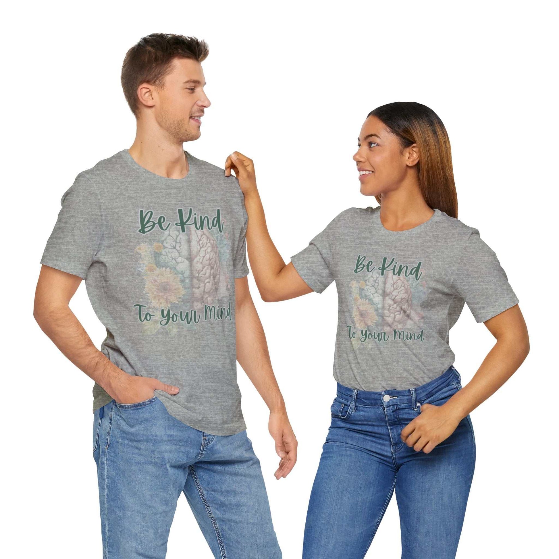 Unisex t-shirt with "Be Kind To Your Mind" mental health affirmation, worn by models.
