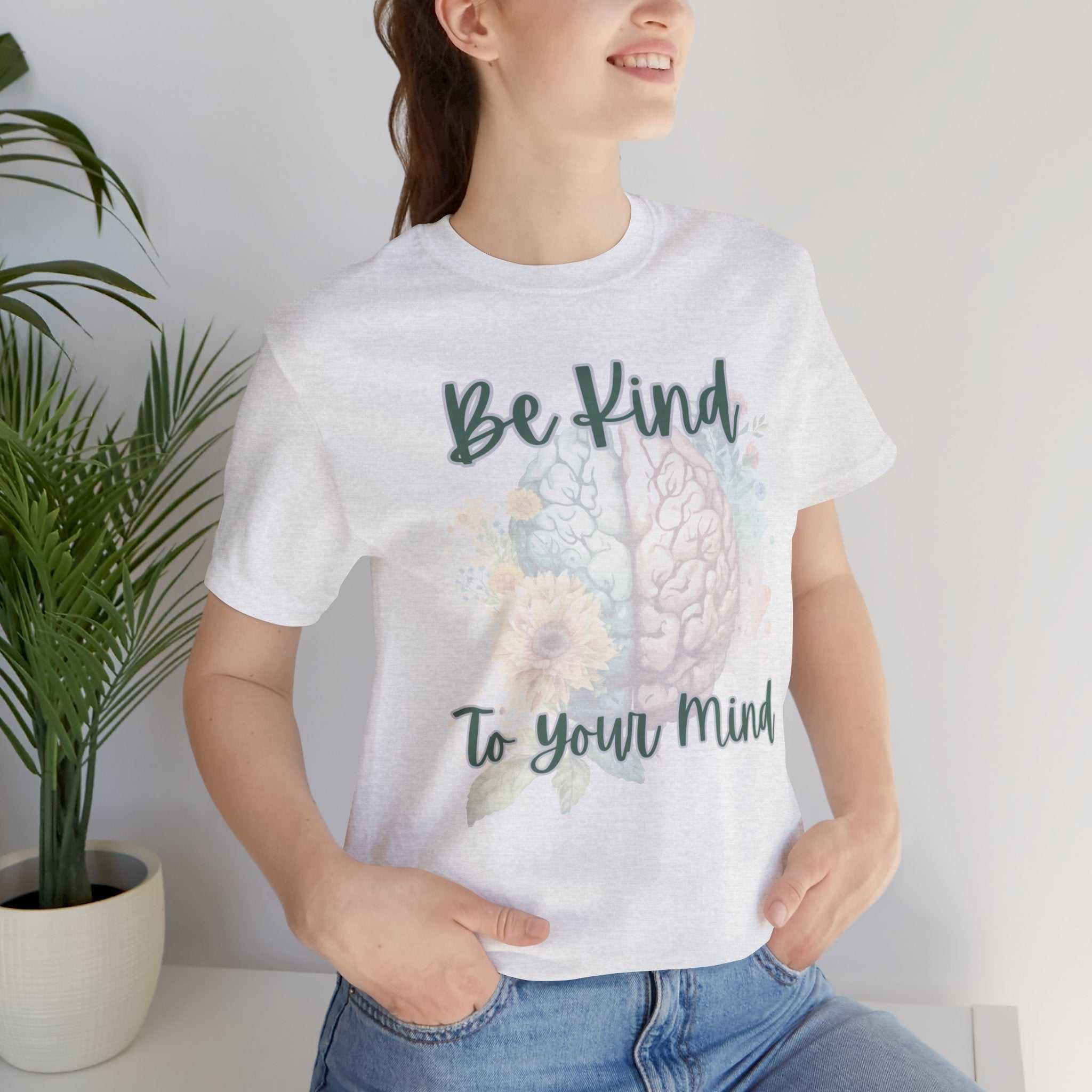 Mental Health Matters Positive Affirmation T-Shirt worn by smiling person standing indoors.
