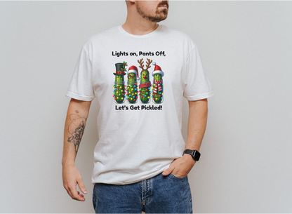 Men's white holiday shirt with festive pickles wrapped in Christmas lights and text "Lights on, Pants Off, Let's Get Pickled"