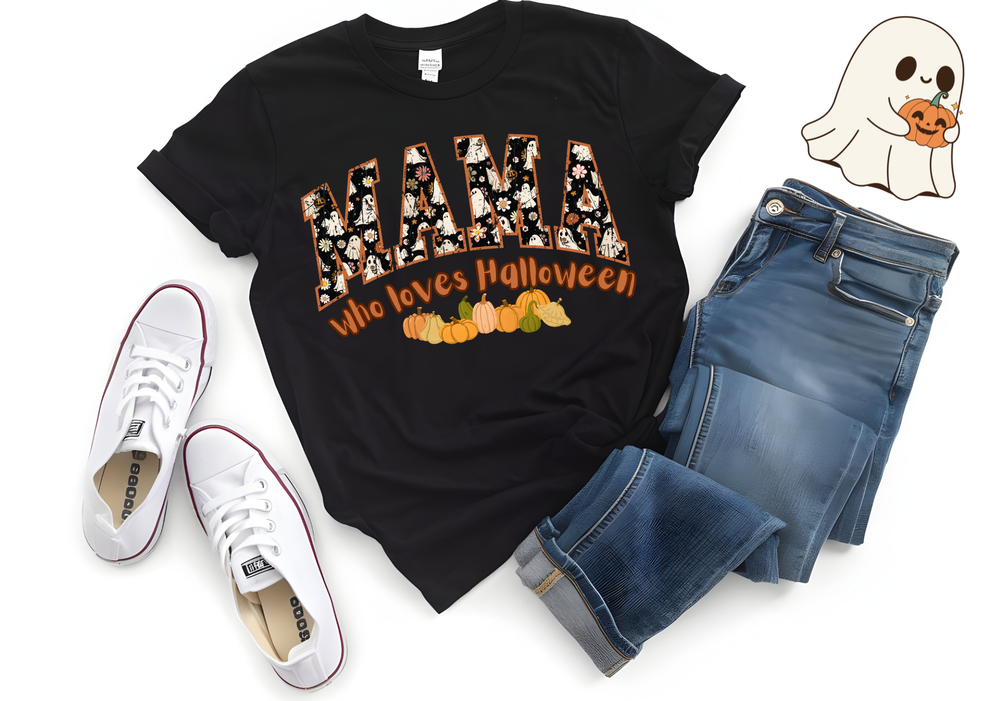 Black "MAMA Who Loves Halloween" fall-themed softstyle shirt with pumpkin graphics, paired with blue jeans and white sneakers.