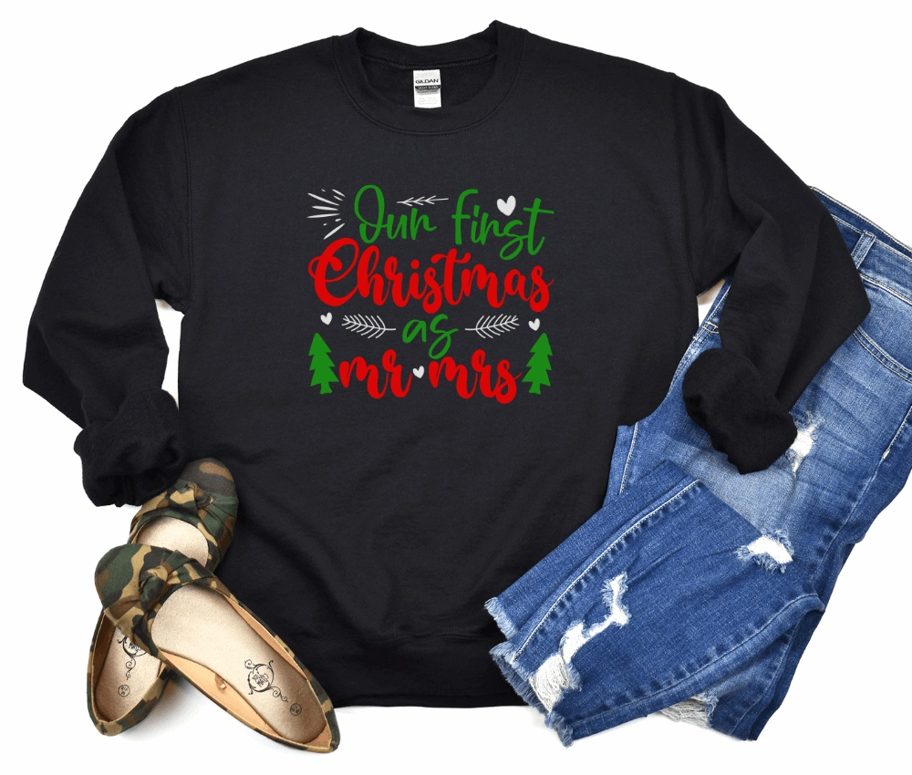 Unisex heavy blend crewneck sweatshirt, "Our First Christmas as Mr & Mrs," newlywed gift, black color, festive red and green design.