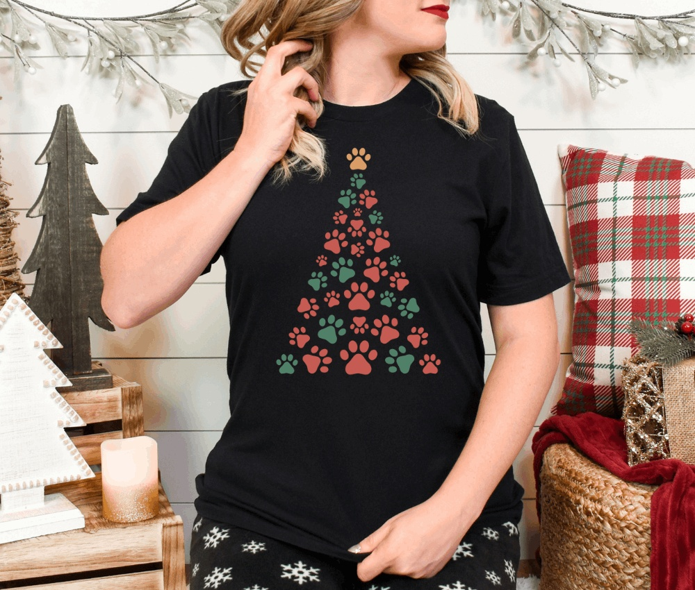 Christmas tree shirt with dog paw prints on unisex Bella Canvas 3001, festive design.