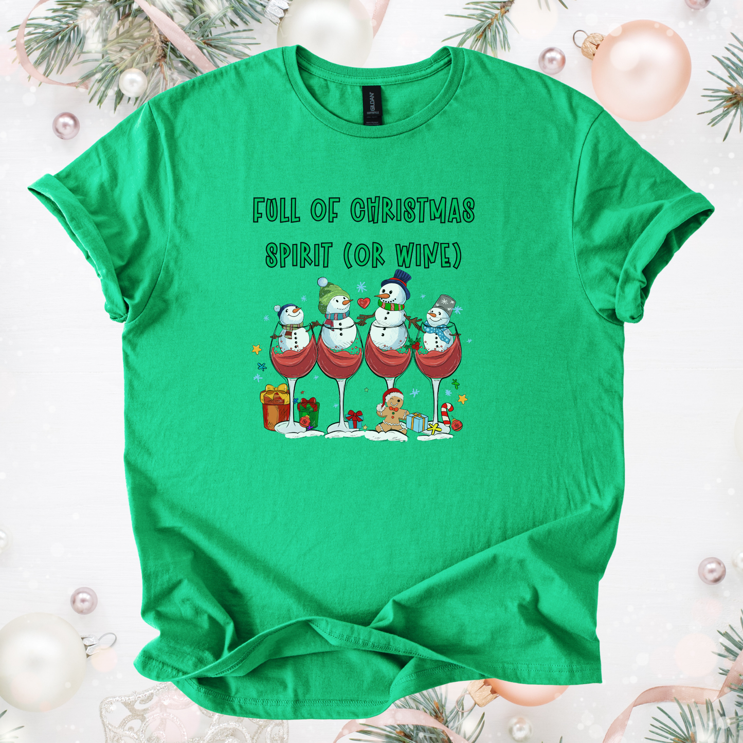 Green festive holiday tee with snowmen in wine glasses and text "Full of Christmas Spirit (or Wine)"