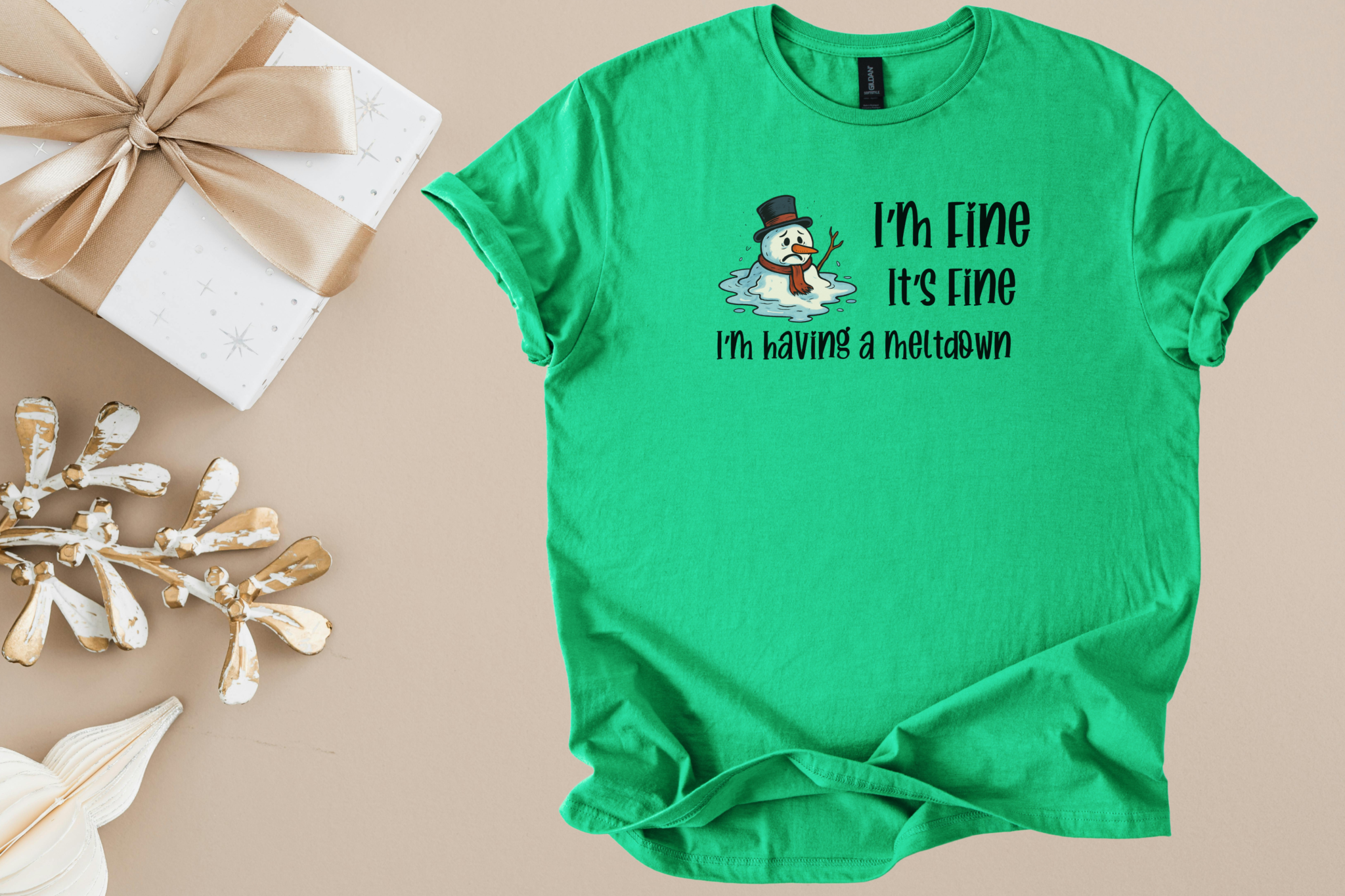 Green unisex shirt with humorous melting snowman and "I'm Fine It's Fine I'm having a meltdown" text design