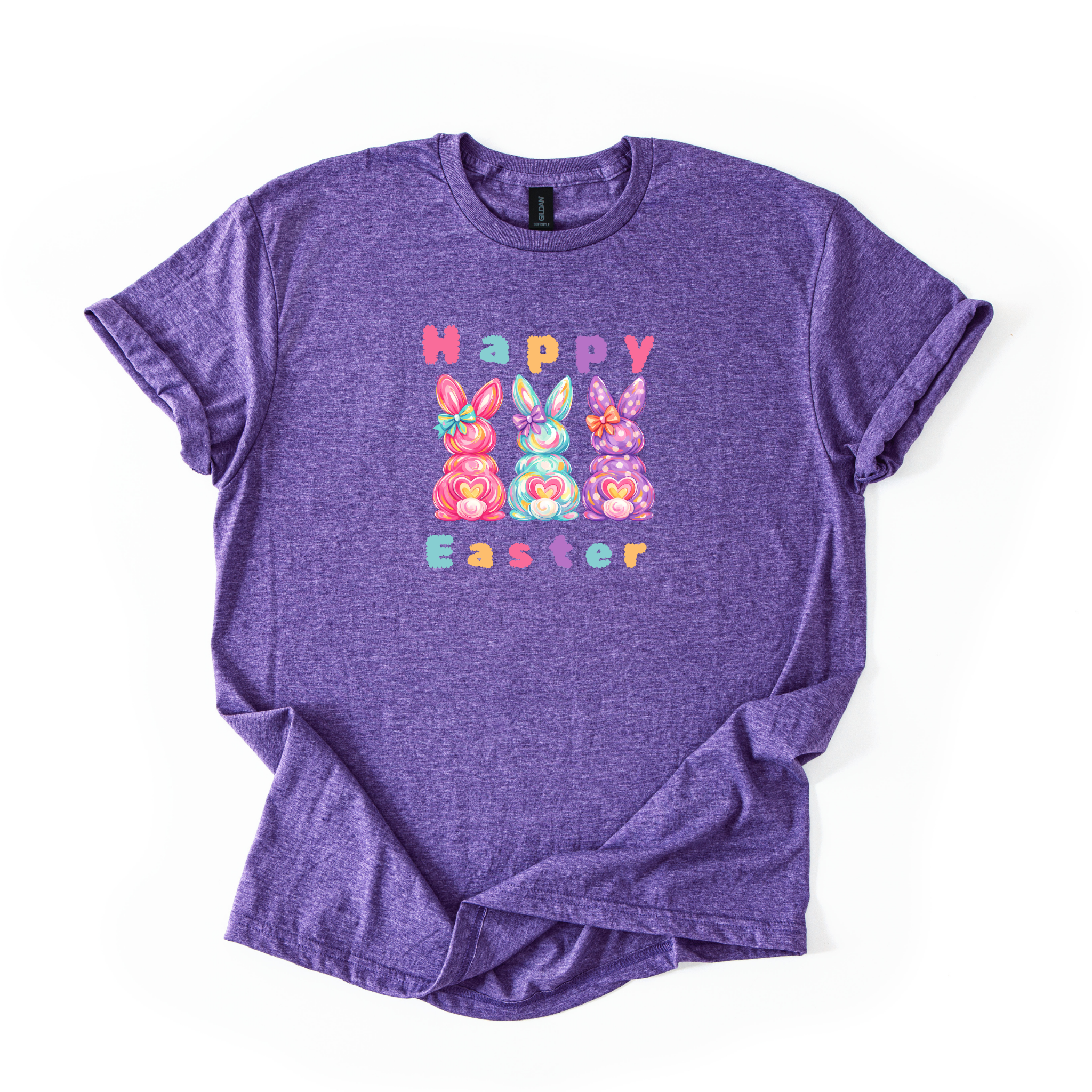 Happy Easter Bunny pastel shirt with three colorful candy-inspired bunnies on softstyle fabric