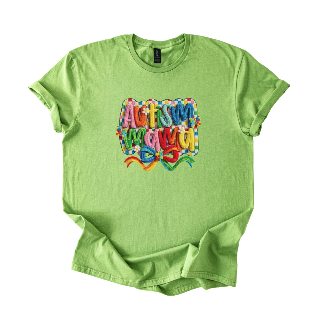 White tee with "Autism Mama" rainbow yarn-style lettering and floral accents