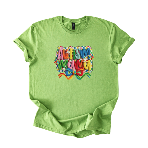 White tee with "Autism Mama" rainbow yarn-style lettering and floral accents