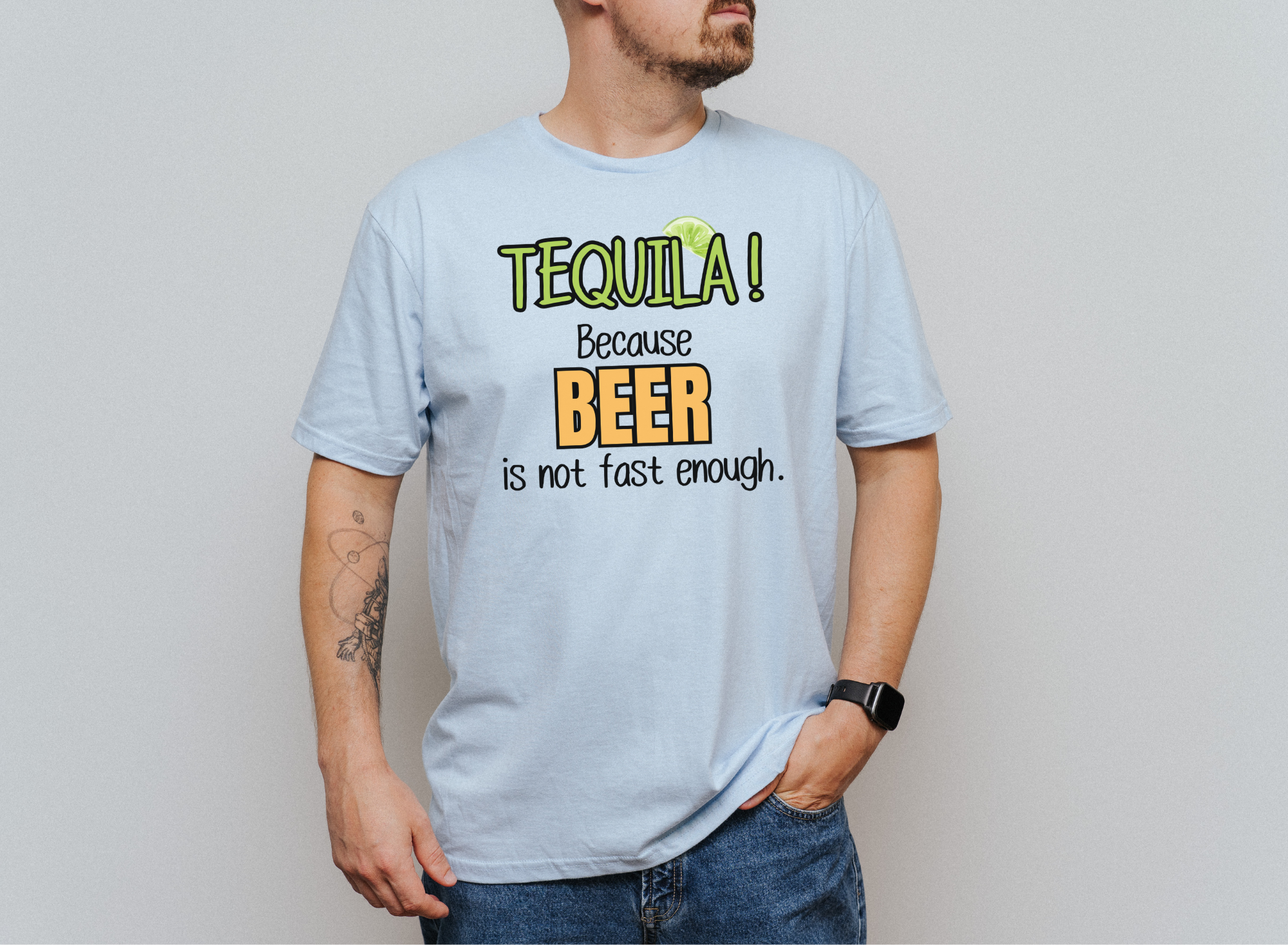 Unisex softstyle shirt with "TEQUILA! Because Beer is not Fast Enough" text, worn by a man.