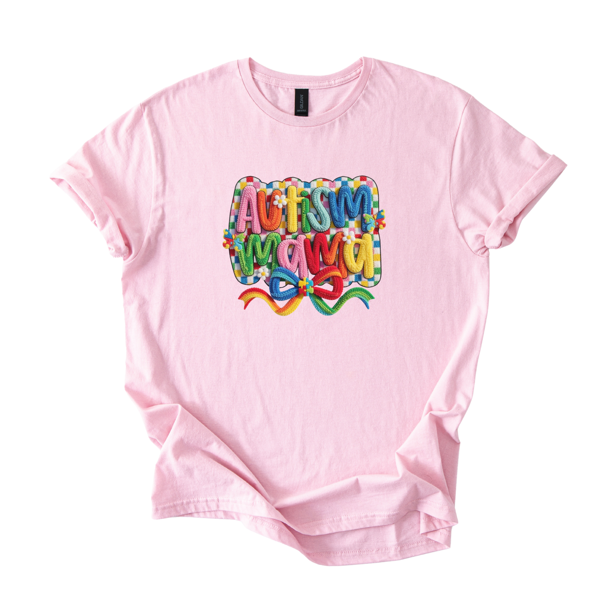 White tee with bold Autism Mama Rainbow crochet-style yarn lettering and colorful floral accents