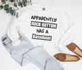 Unisex sweatshirt with "Apparently Rock Bottom Has A Basement" quote, perfect gift for men and women with a sense of humor.