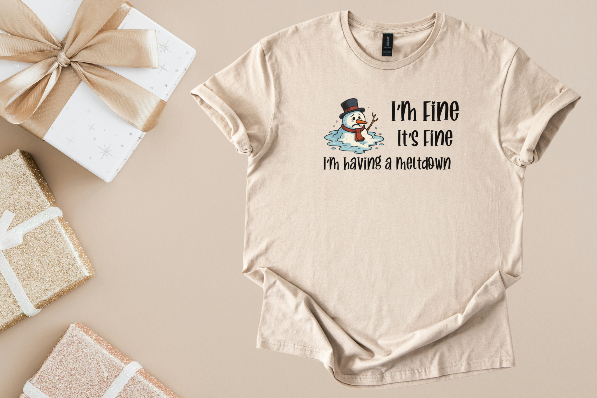Beige unisex softstyle shirt with a melting snowman and "I'm Fine It's Fine I'm having a meltdown" text, holiday humor tee