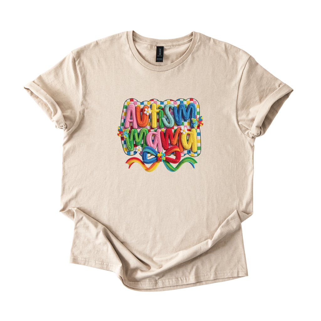 White tee with Autism Mama Rainbow crochet-style yarn lettering and colorful floral accents