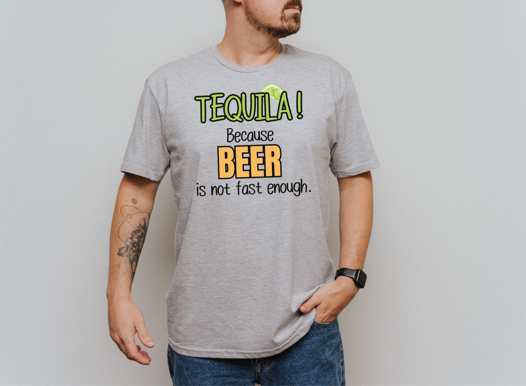 Unisex softstyle T-shirt with "TEQUILA! Because Beer is not Fast Enough" graphic, worn by a person.