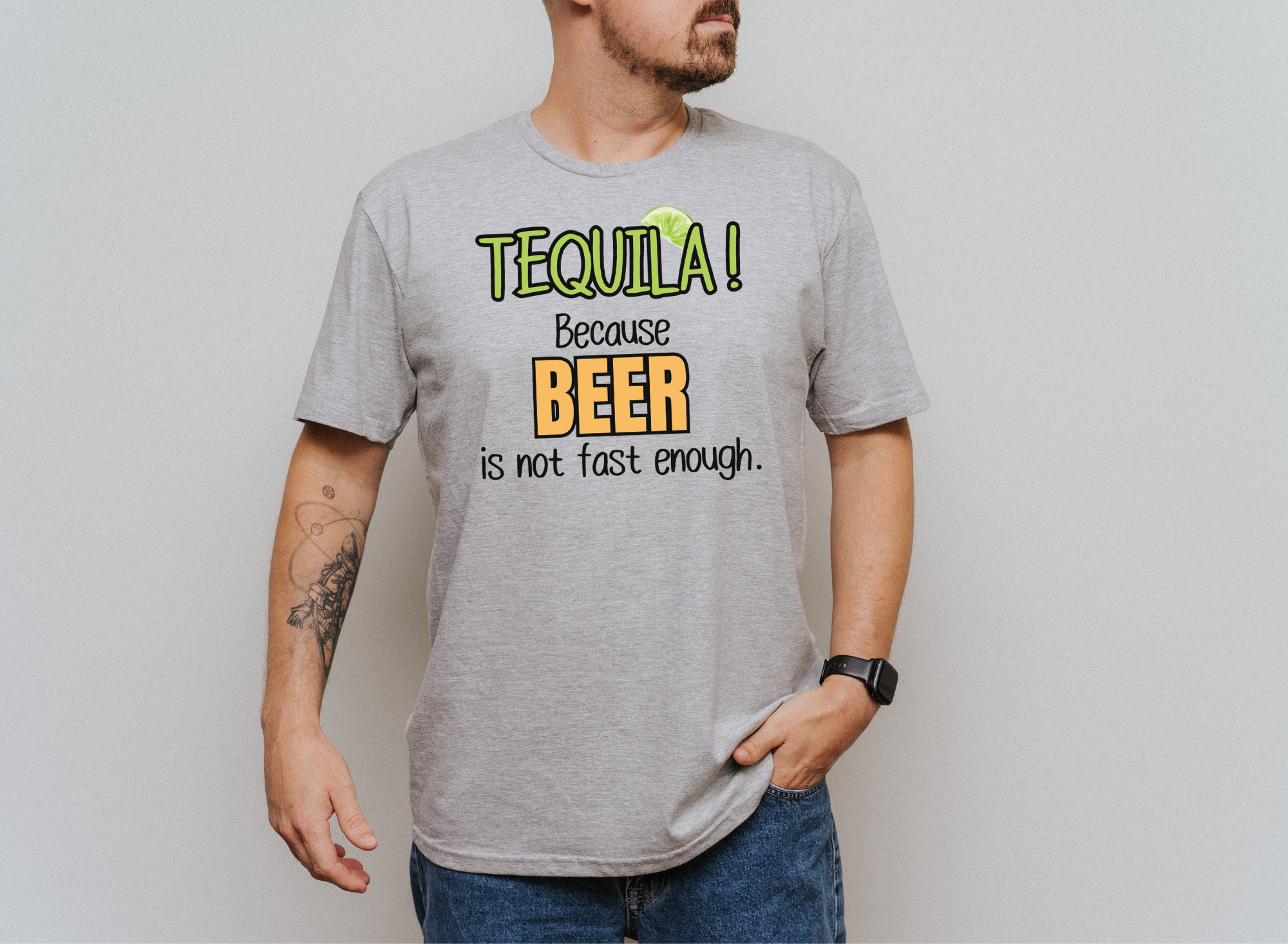 Unisex softstyle T-shirt with "TEQUILA! Because Beer is not Fast Enough" graphic, worn by a person.